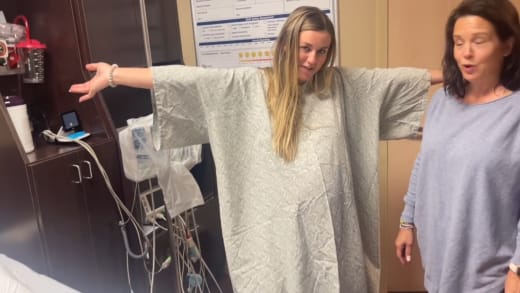 Katey Nakatsu wears an oversized hospital gown