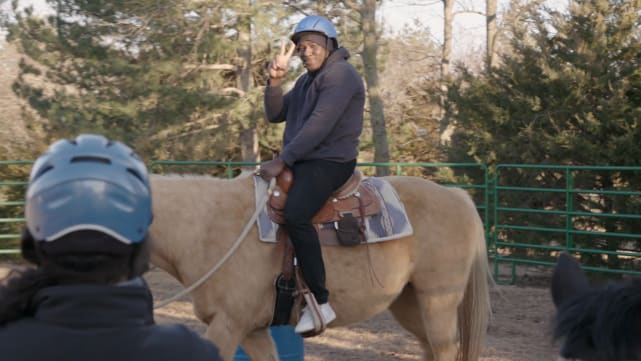 Kobe rides a horse