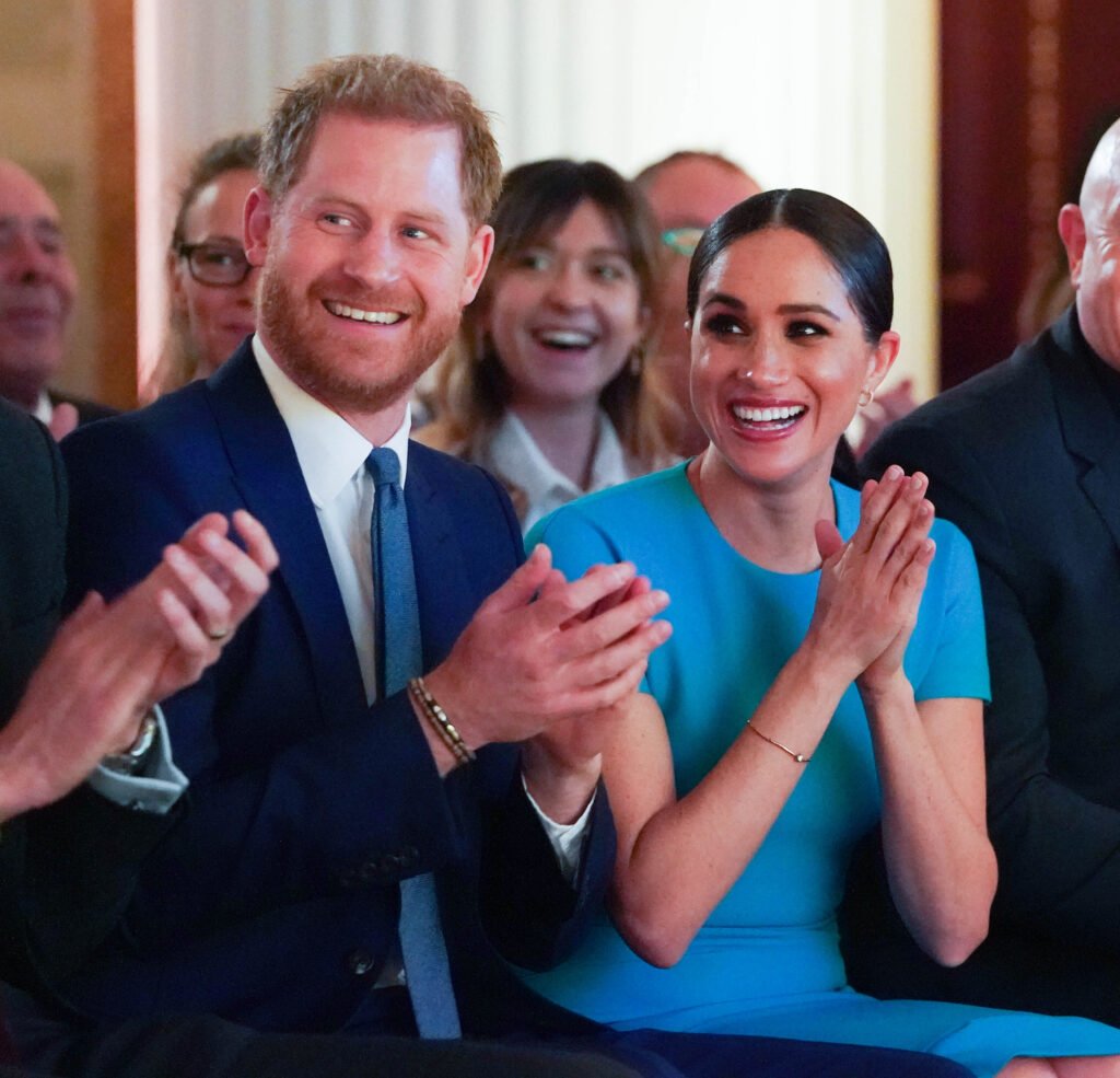 Meghan Markle and Prince Harry Clap