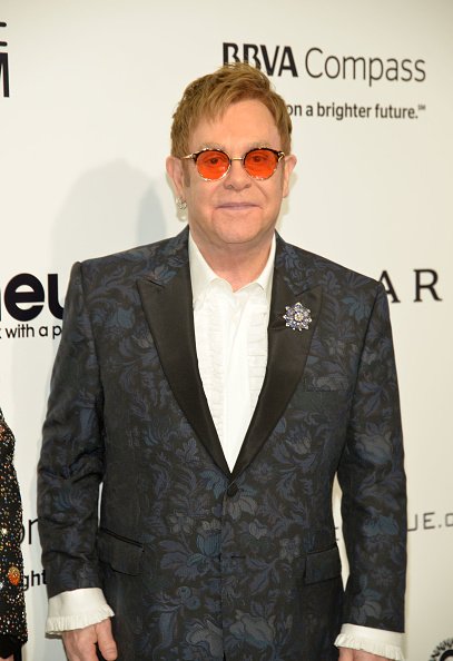 Elton John Has Red Shades