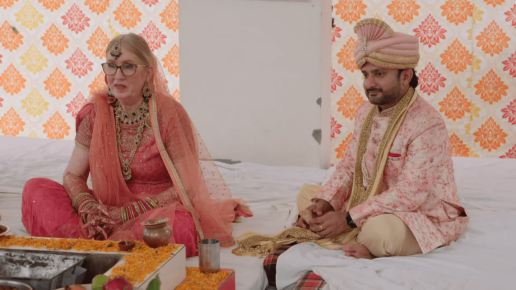Jenny Slatten and Sumit Singh sit for their wedding ceremony