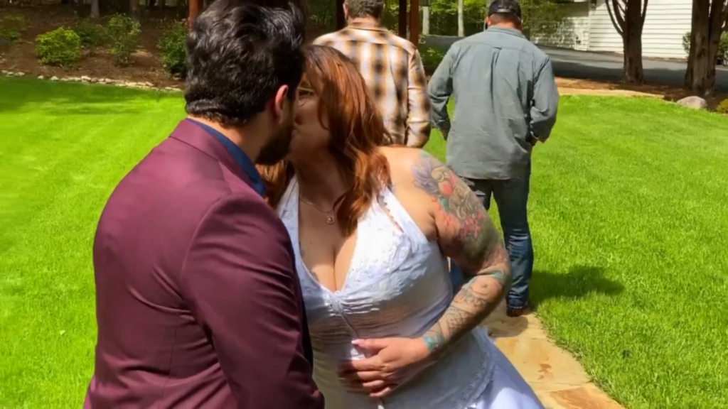 Rebecca Parrott kisses Zied Hakimi on their wedding day