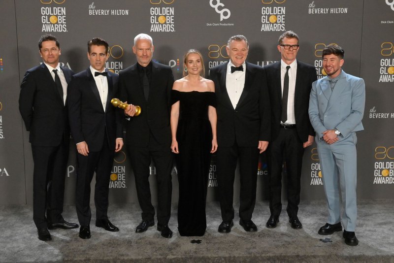 Left to right, Peter Czernin, Colin Farrell, Martin McDonagh, Kerry Condon, Brendan Gleeson, Graham Broadbent, and Barry Keoghan appear backstage after winning the award for Best Picture - Musical/Comedy for "The Banshees of Inisherin" during the 80th annual Golden Globe Awards at the Beverly Hilton in Beverly Hills, Calif. on Tuesday. The film was nominated for five SAG Awards on Wednesday. Photo by Jim Ruymen/UPI