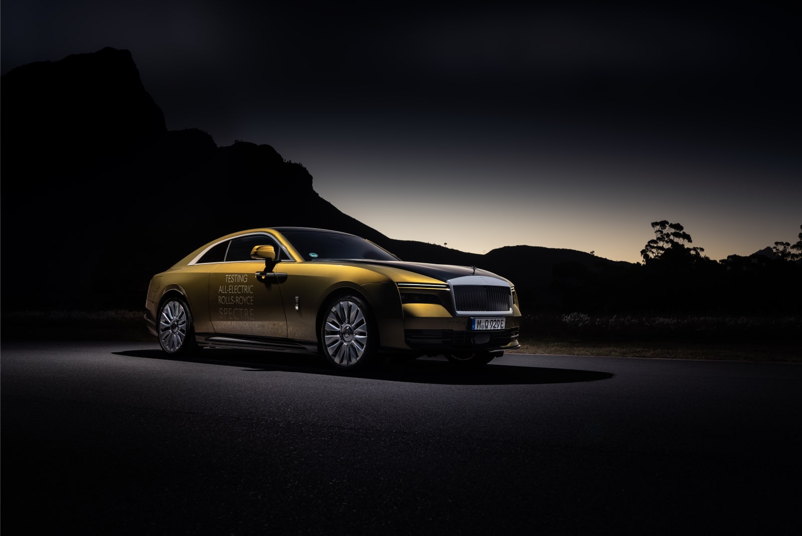 Rolls Royce Spectre EV parked outside at sunset