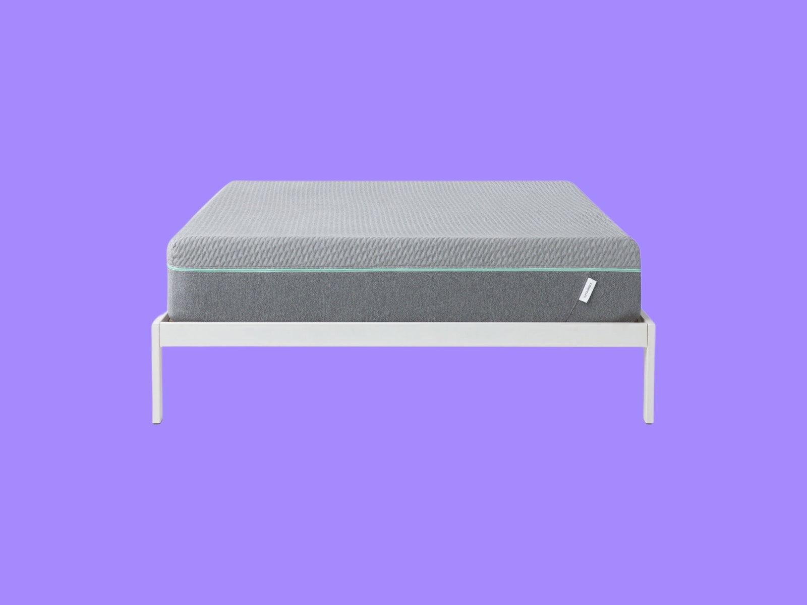 Tuft and Needle Mint Mattress on purple backdrop