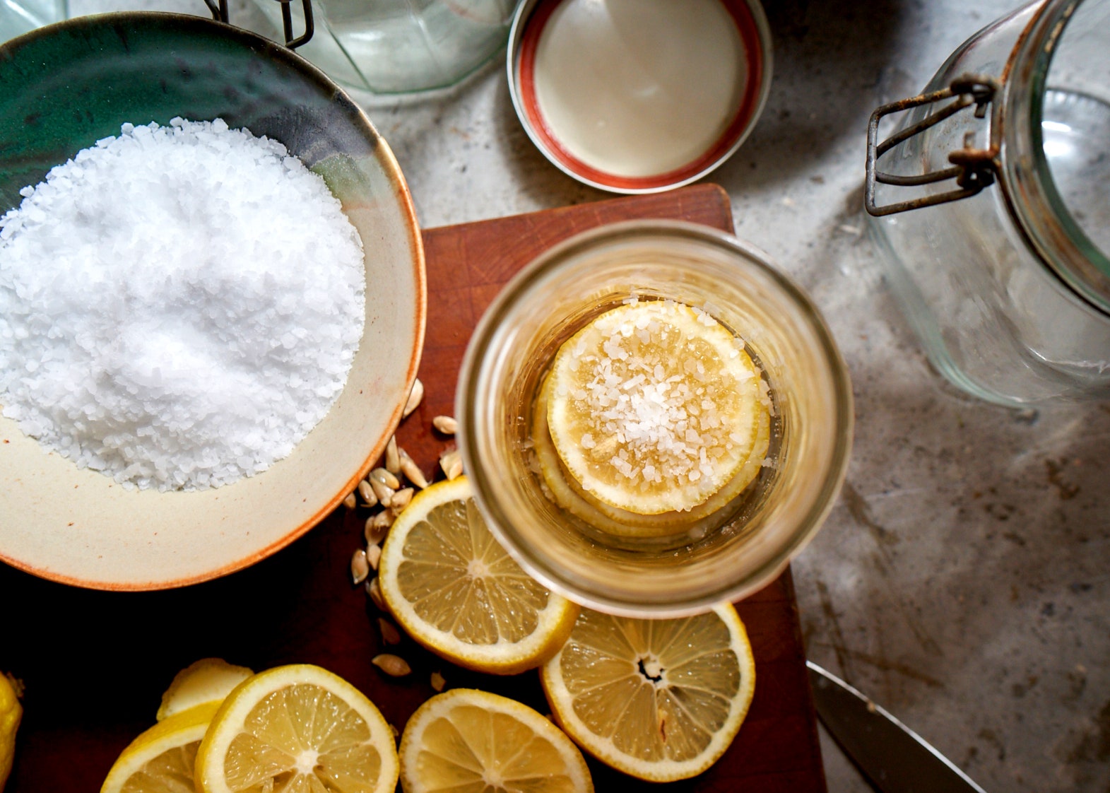 Lemons and salt next to cookware