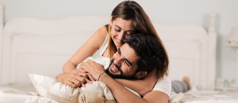 Playful couple on bed 