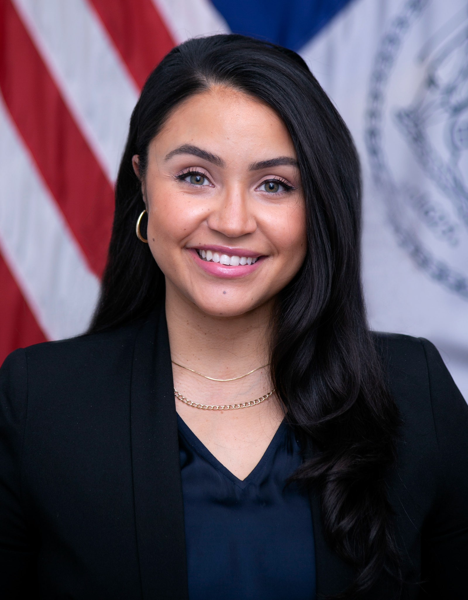 Smiling person wearing a business suit