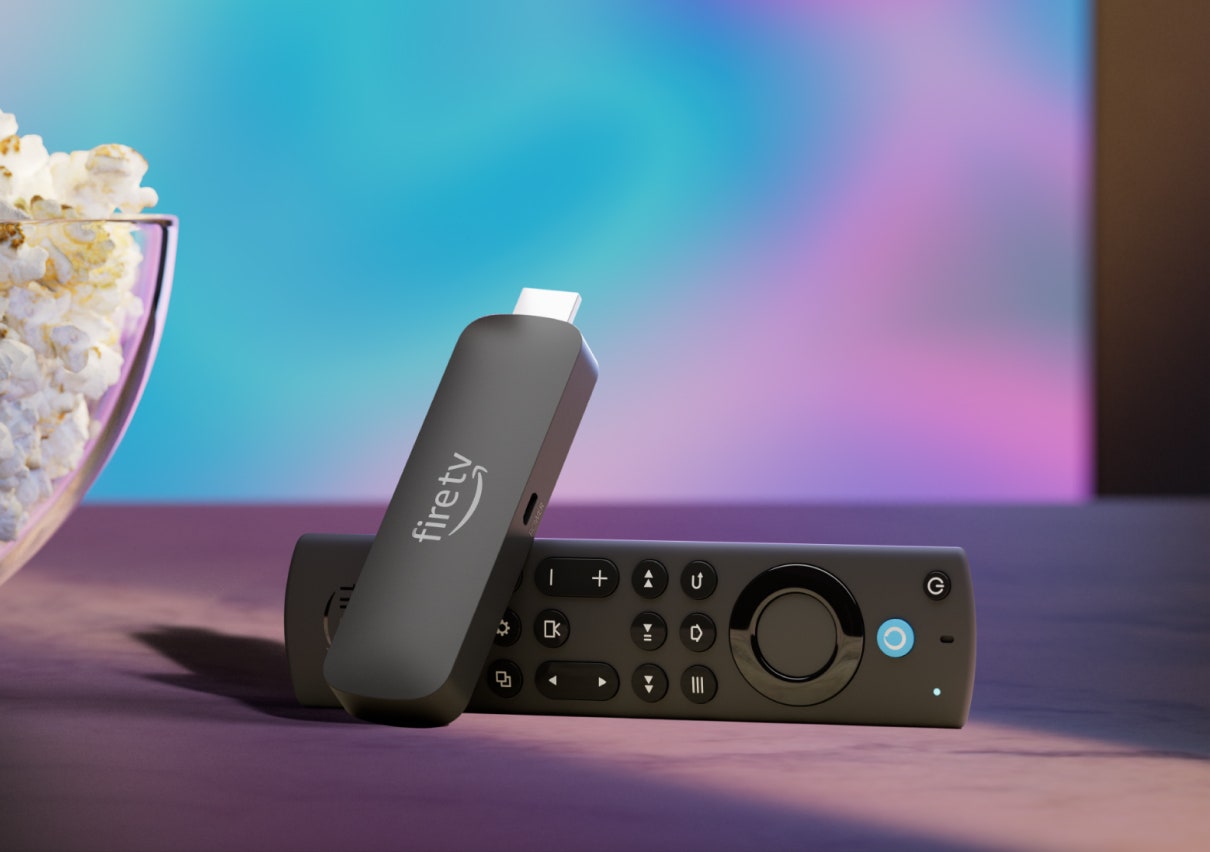 Amazon Fire TV Stick 4K Max next to a bowl of popcorn