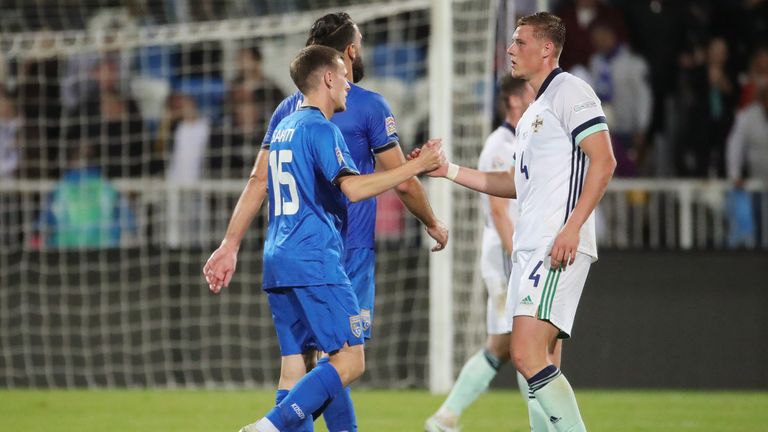 Daniel Ballard of Northern Ireland shakes hands with Emir Sahiti of Kosovo at full-time