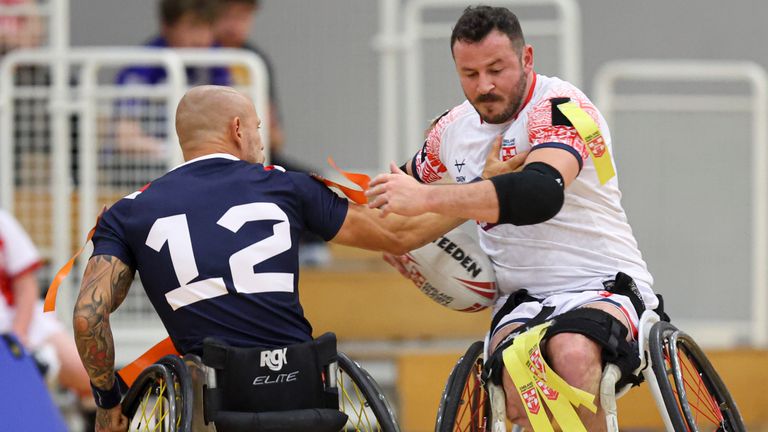 France's Guillaume Mautz is tackled England's Seb Bechara