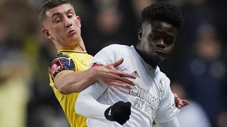 Oxford United&#39;s Cameron Brannagan and Arsenal&#39;s Bukayo Saka battle for the ball during the Emirates FA Cup third round match at the Kassam Stadium, Oxford. Picture date: Monday January 9, 2022.