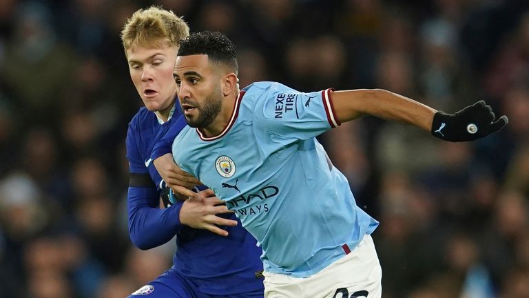 Riyad Mahrez is challenged by Lewis Hall