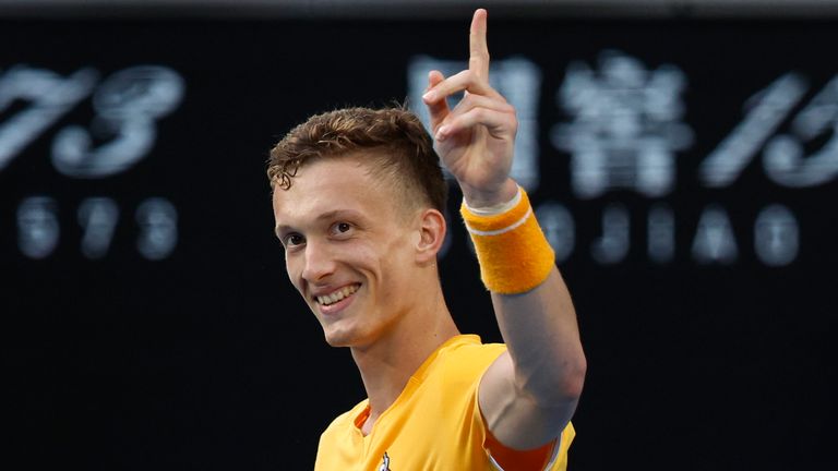 Jiri Lehecka of the Czech Republic celebrates after defeating Felix Auger-Aliassime of Canada during their fourth round match at the Australian Open tennis championship in Melbourne, Australia, Sunday, Jan. 22, 2023. (AP Photo/Asanka Brendon Ratnayake)