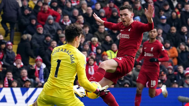 Kepa Arrizabalaga saves at the feet of Andrew Robertson