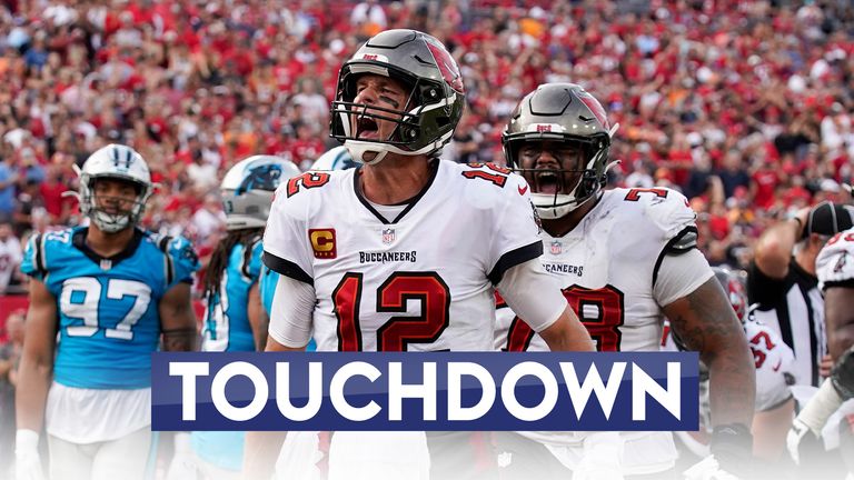 Tampa Bay Buccaneers quarterback Tom Brady scored four touchdowns as the Bucs confirmed their playoff spot with a win over the Panthers