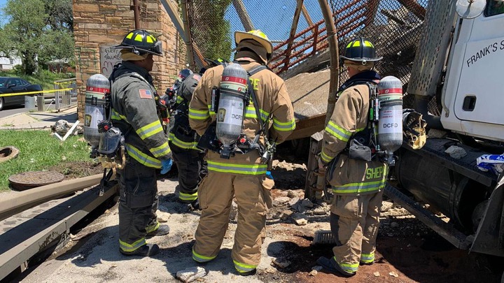 5 people hospitalized after pedestrian bridge collapses onto DC highway (photos)