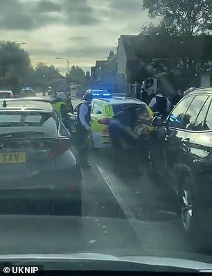 This is the moment a female Met officer is crushed by an undercover police car during a robbery chase in South London today