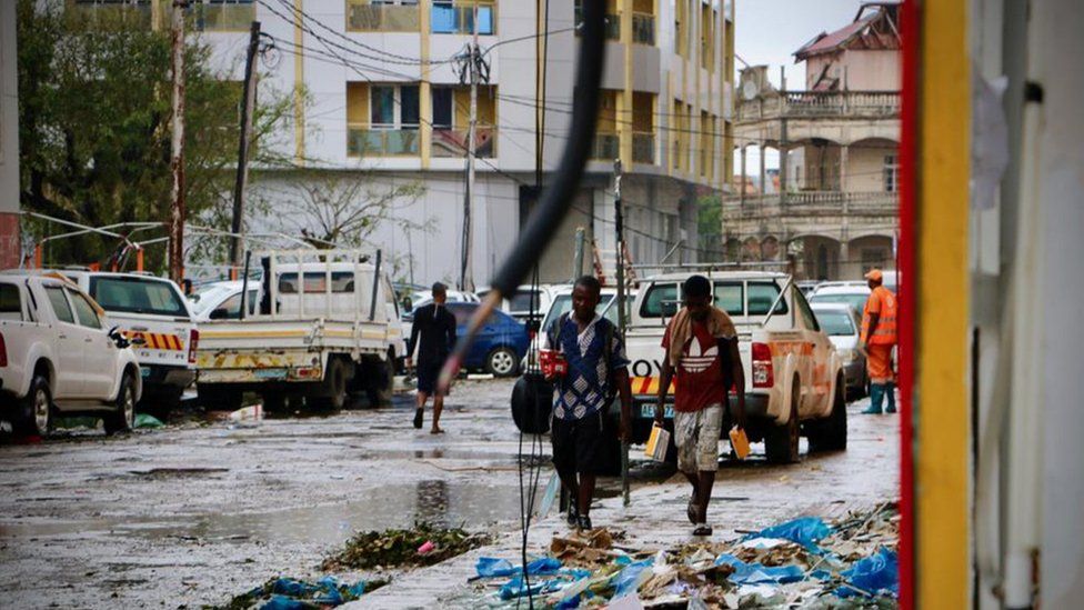 People walk through the ravaged pavements of Beira, Mozambique