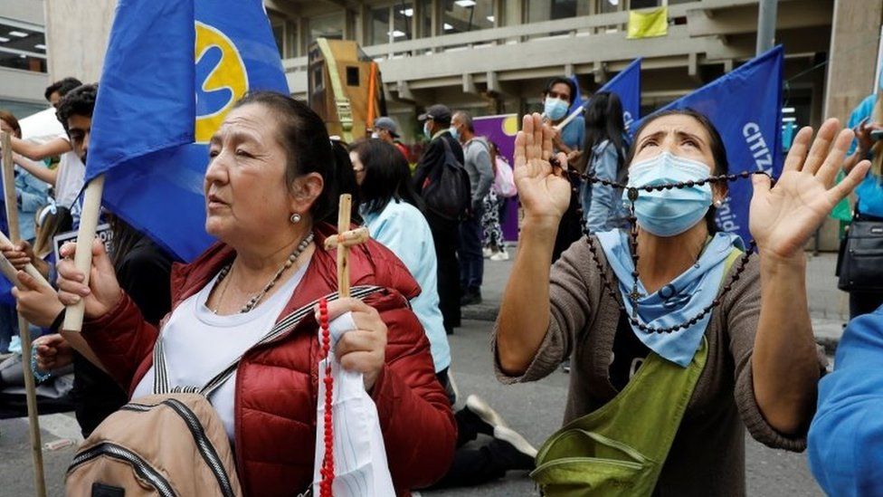 Women against abortion pray in a protest against decriminalization, in front of the headquarters of the Constitutional Court, in Bogota, Colombia, 21 February 2022