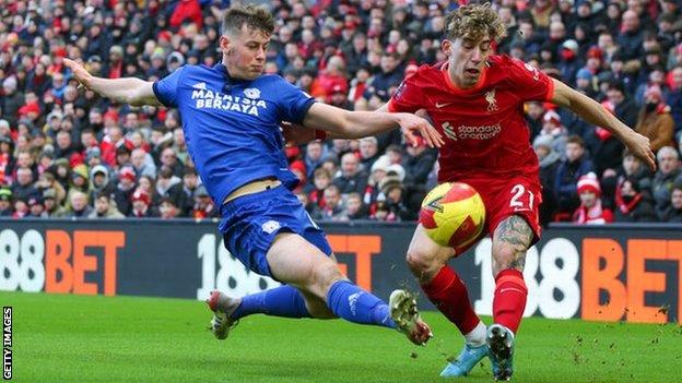 Oliver Denham of Cardiff City and Kostas Tsimikas of Liverpool