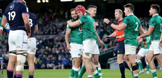 Jamison-Gibson Park and Josh van der Flier embrace after beating Scotland