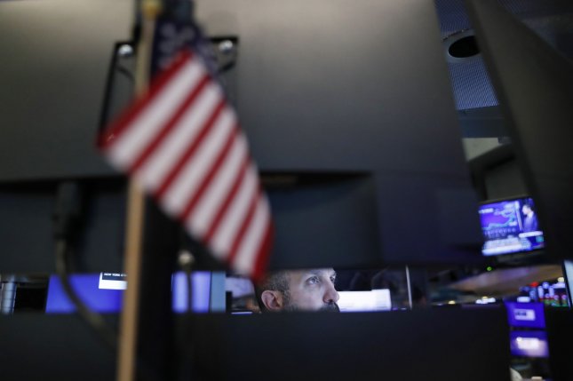 Dow falls 144 points as Federal Reserve officials maintain hawkish stance