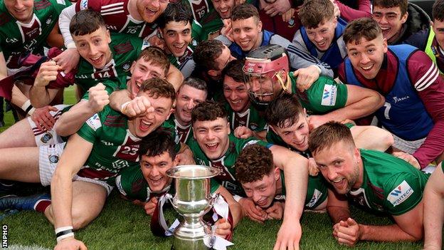 Westmeath players celebrate with the trophy