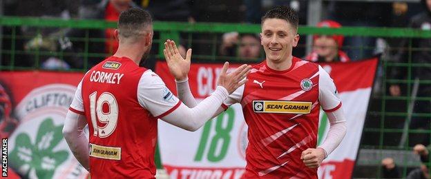 Joe Gormley congratulates Cliftonville strike partner Ryan Curran