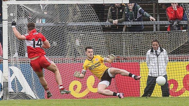 Derry forward Shane McGuigan scores the only goal of the game from a first-half penalty