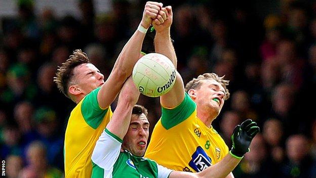 Jason McGee and Hugh McFadden fight out an aerial duel with Fermanagh's Ryan Jones in the 2019 Ulster quarter-final