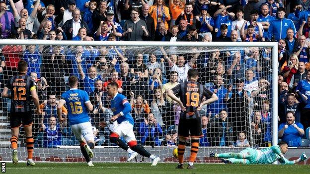 James Tavernier celebrates after scoring a penalty