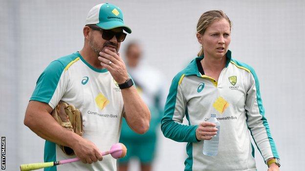 Matthew Mott and Meg Lanning in conversation at a training session