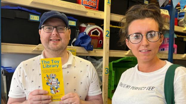 Kieran and Christine McMahon signing up at the Toy Library.