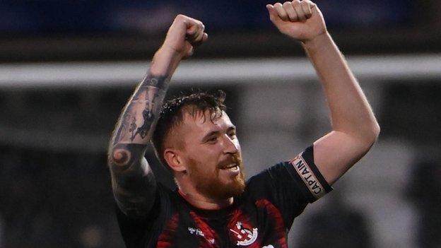 Billy Joe Burns celebrates after hitting Crusaders' dramatic injury-time winner against Bruno's Magpies of Gibraltar