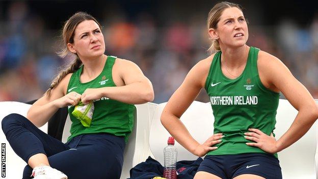 Anna McCauley (left) and Kate O'Connor look at results on the big screen in Birmingham