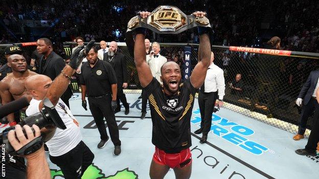 Leon Edwards celebrates beating Kamaru Usman