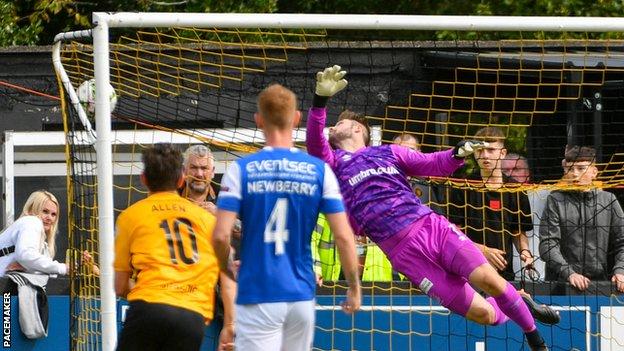 Blues keeper Chris Johns is unable to keep out Andy Mitchell's superb strike to put Carrick in front