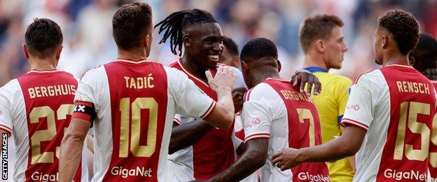 Calvin Bassey (centre) celebrates with Ajax