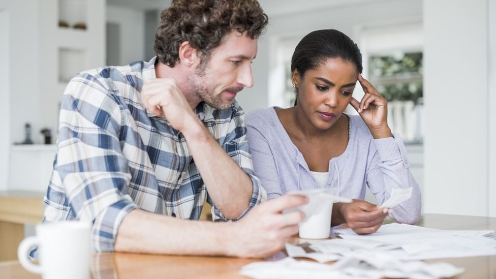 Couple looking at a bill