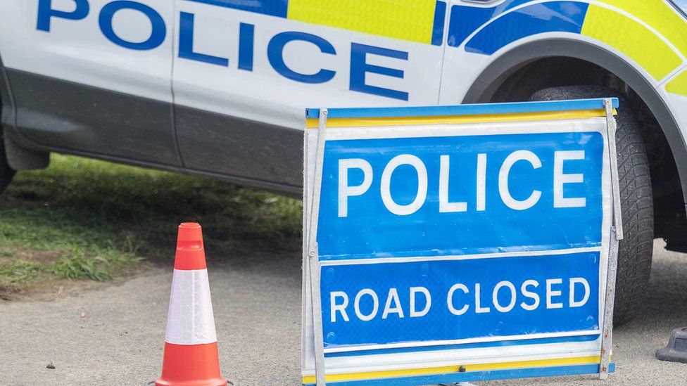 Police road closed sign