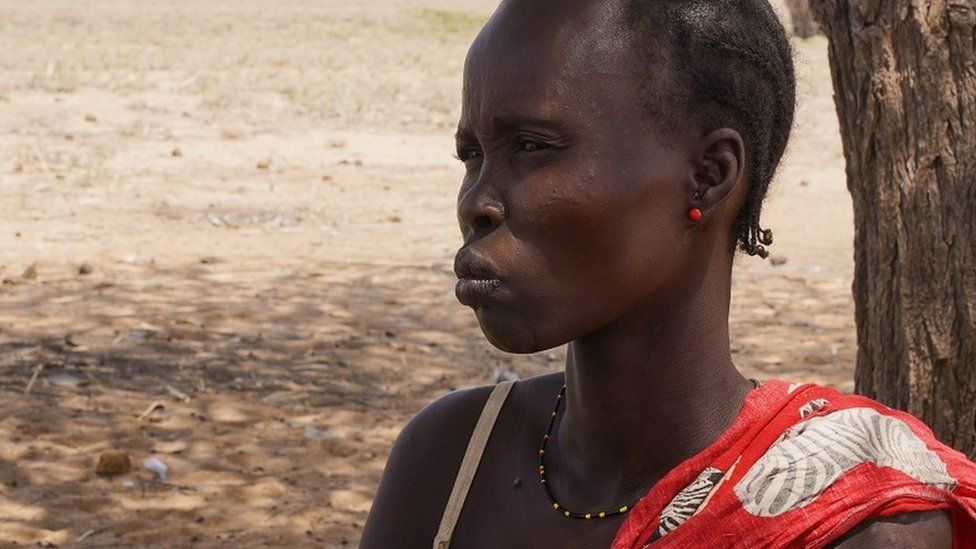 Kenyan woman under a tree