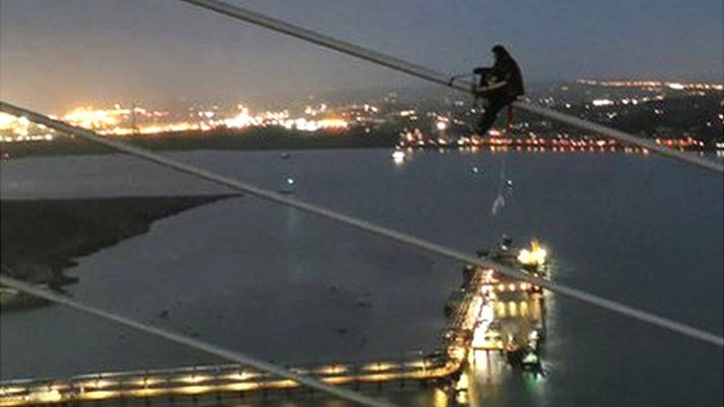 A Just Stop Oil protester at the QE2 Bridge