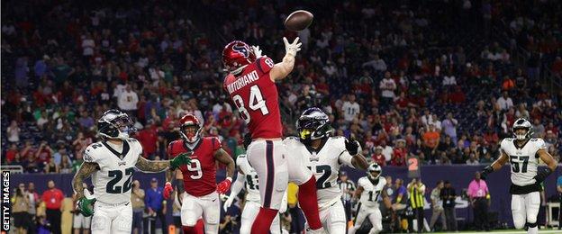 Teagan Quitoriano of the Houston Texans catches a touchdown pass against the Philadelphia Eagles