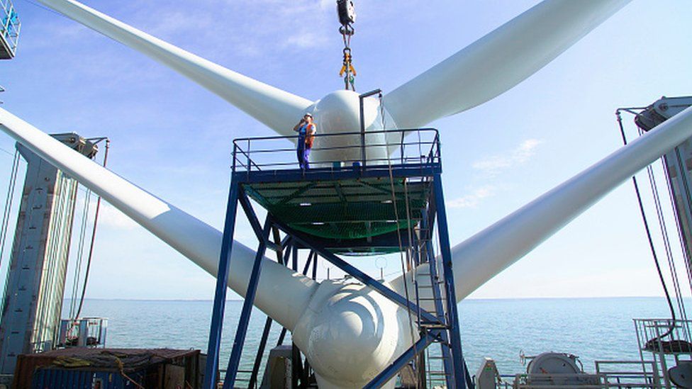 A ship ready for lifting into place a wind turbine off the coast of Kent