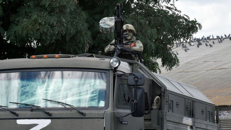 File pic of a Russian serviceman guards a grain elevator in Melitopol, Zaporizhzhia region, on July 14, 2022, amid the ongoing Russian military action in Ukraine