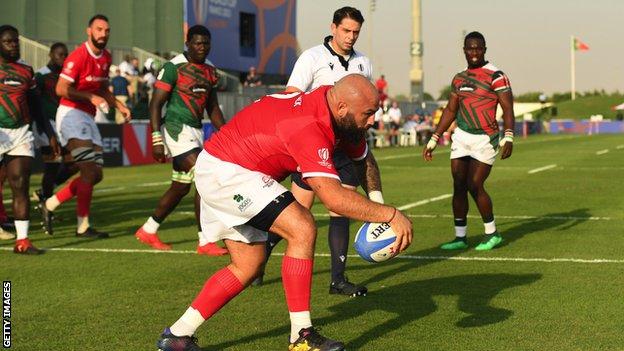 Mike Tadjer scores a try against Kenya