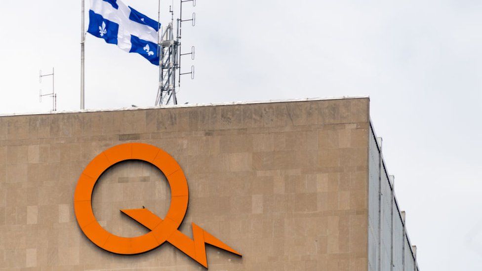 Hydro Quebec sign logo on top of headquarter building in the downtown district of Montreal.