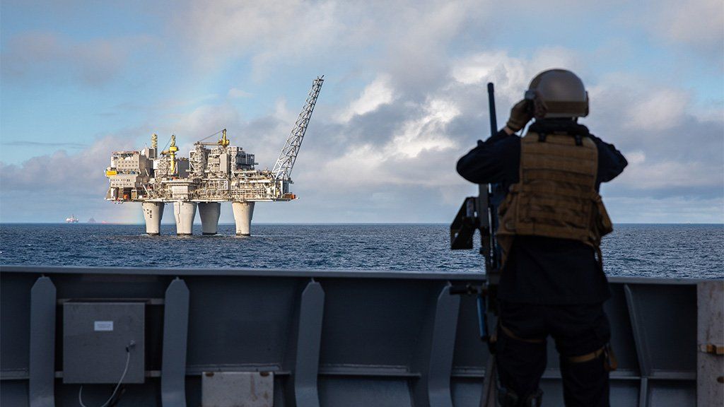 Soldier observes an oil rig