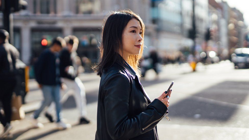 Woman crossing the road